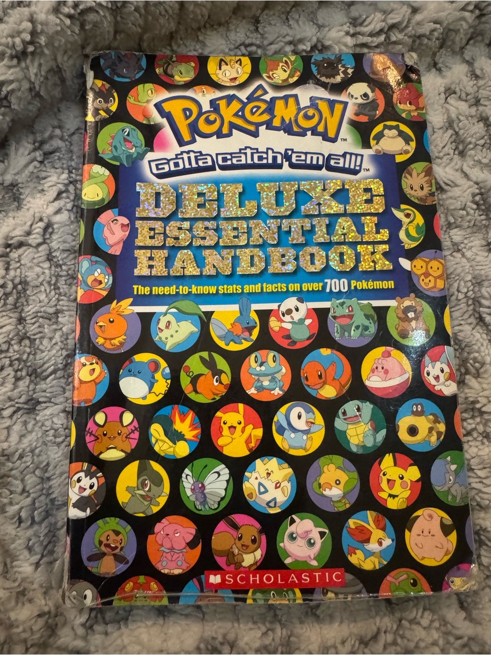 Scholastic Pokémon Deluxe Essential Handbook – Blue & Multicolor Character Cover
